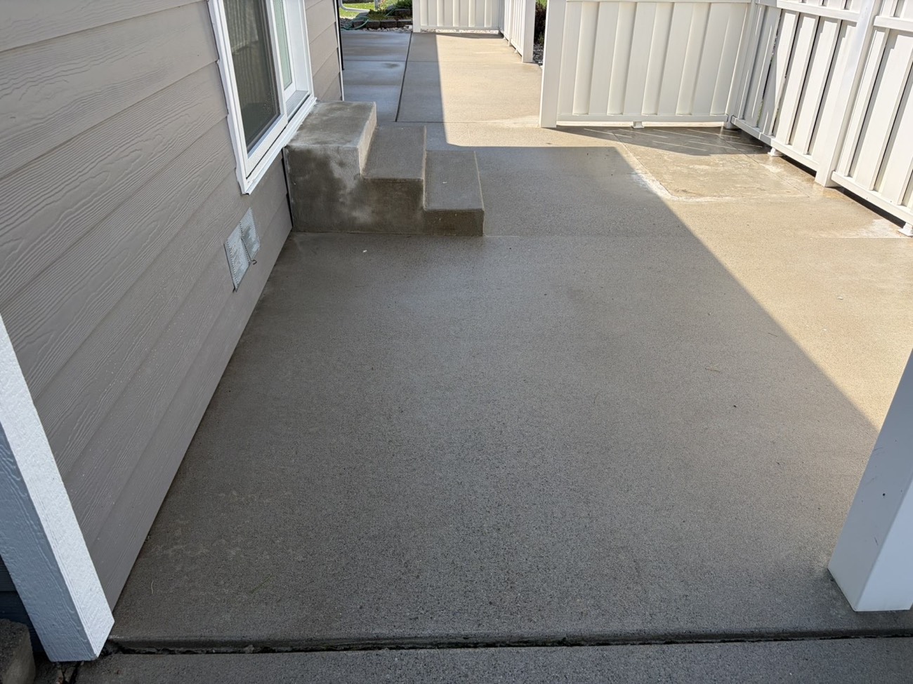 Covered porch walkway and steps cleaned to an even finish
