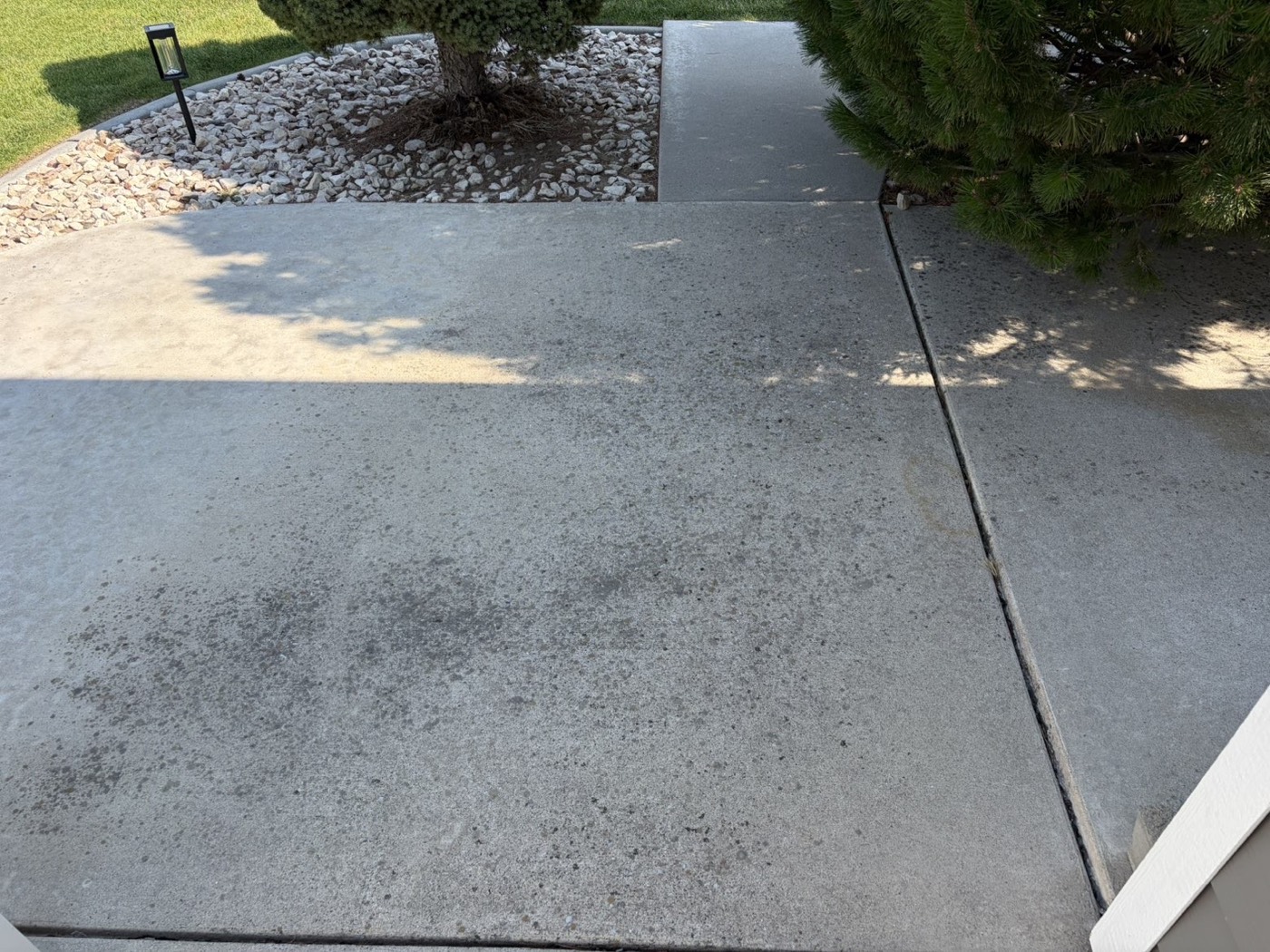 The same walkway before cleaning — greyed and grimy